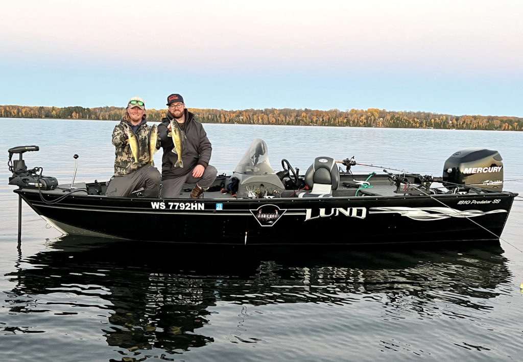 Northern Wisconsin Fishing Guide Captain Cletus with his good friend Colin aboard the Lund Predator